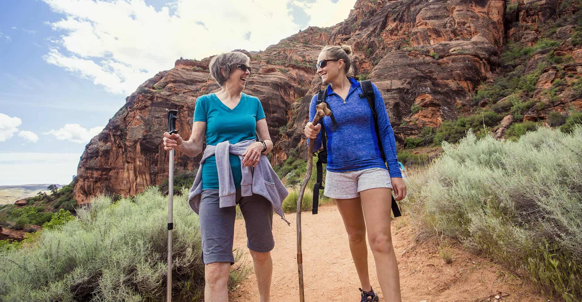 Mother and Daughter Hiking on Trail